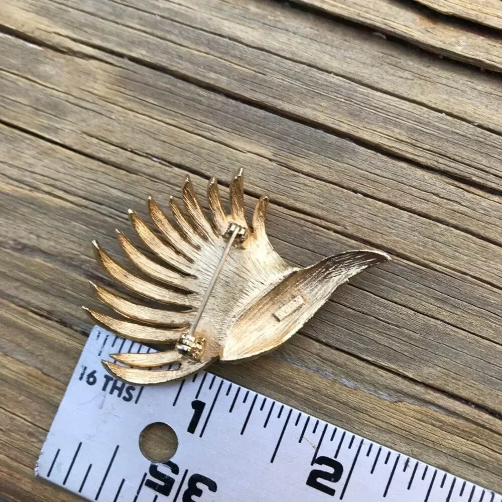 Estate signed CORO brushed gold tone textural swirl brooch / pin